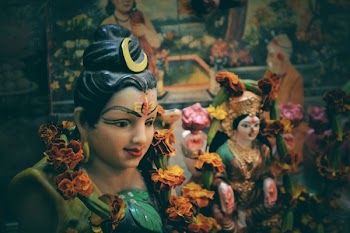 Depth of Field Photo of Diety God Statuette