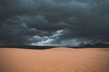 desert under nimbus clouds