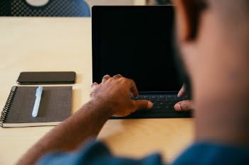 Designer working at a startup using an iPad