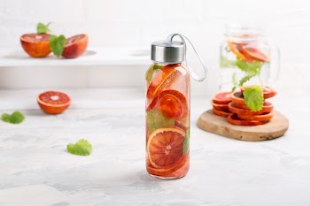 Detox infused water flavored with bloody orange and mint. Healthy refreshing beverage