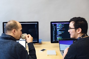 Developers Discussing Javascript Code
