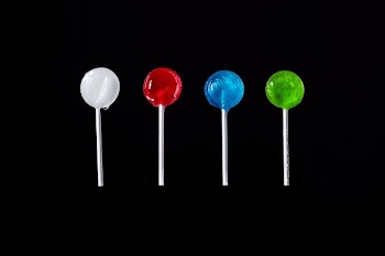 Different Colored Lollipops On Black