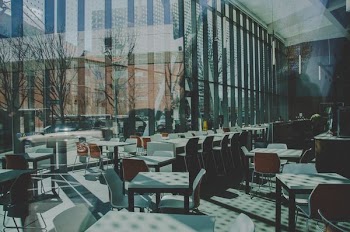 dining room inside glass walled building during daytime