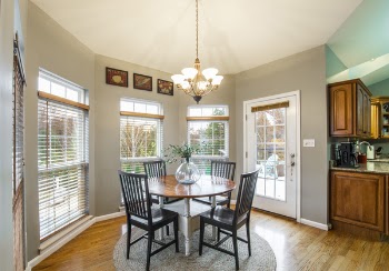 Dining Table Under Uplight Chandelier