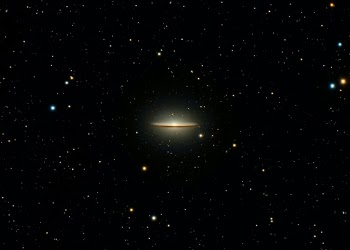 Discovered in 1781 by the French astronomer and comet hunter, Pierre Méchain, the Sombrero galaxy is a lenticular galaxy, which is a classification between full elliptical and spiral, meaning that it has a disc structure but without spiral arms.  It’s about 31 million light years away in the constellation of Virgo and about 50 million light years across (one-third of the Milky Way’s diameter).  Astronomers have determined that the supermassive black hole at the center of the galaxy is about 1 billion solar masses, making it one of the largest in nearby galaxies.  They’ve also determined that there are between 1,200 and 2,000 globular clusters present, more than ten times the estimate for the Milky Way’s population, and they’ve been able to correlate the prevalence of globular clusters with the amount of bulge in the galaxy.  Using infrared spectroscopy astronomers have also determined that the bulk of star formation occurs within the highly contrasted dust lane.

This is 2:20 hours of exposure.