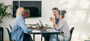Diverse business colleagues having a meeting together in an offi