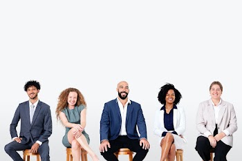 Diverse business people smiling while sitting… | Free stock photo | High Resolution image