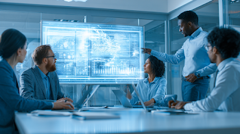 Diverse Business Team Analyzing Data in Modern Office