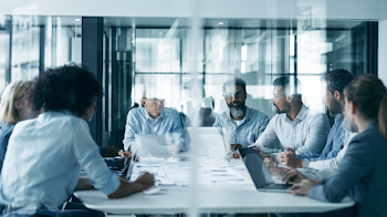 Diverse Business Team Collaborating in Modern Conference Space