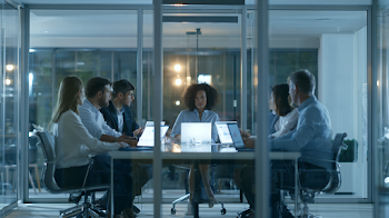 Diverse Business Team Collaborating in Modern Meeting Room