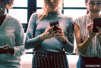 Diverse people using phone