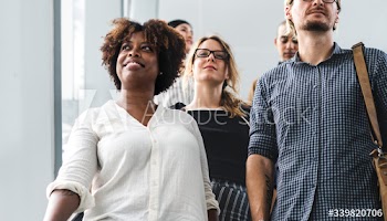 Diverse people walking in a building