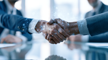 Diverse Professionals Shaking Hands in a Modern Office