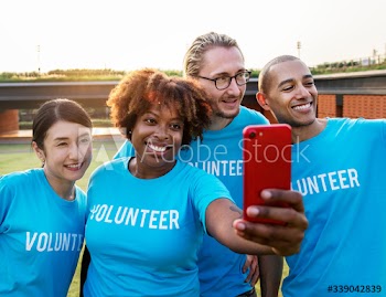 Diverse volunteers taking a selfie together