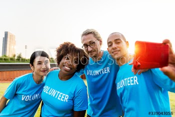 Diverse volunteers taking a selfie together