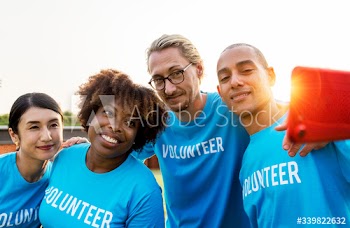 Diverse volunteers taking a selfie together