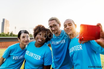 Diverse volunteers taking a selfie together