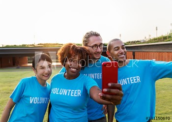 Diverse volunteers taking a selfie together