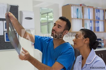 Doctor and nurse discussing x-ray in hospital