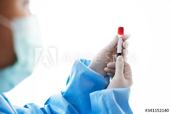 Doctor holding a blood test tube