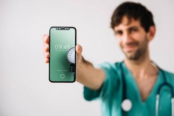 Doctor showing smartphone mockup Free Psd