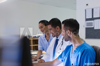 Doctors and nurse consulting in hospital