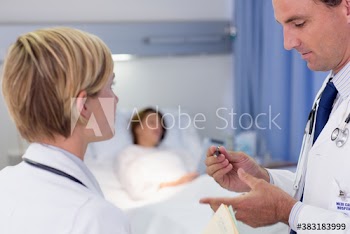 Doctors making rounds in hospital