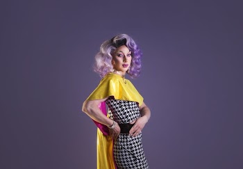 Drag Performer With Purple Wig Twists