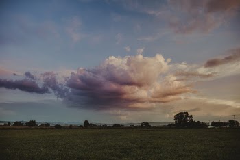 Dramatic Clouds Above A Farmland