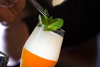 Drinking Glass Filled with Beverage and Mint leaves