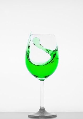 Drinking Glass Filled With Green Liquid