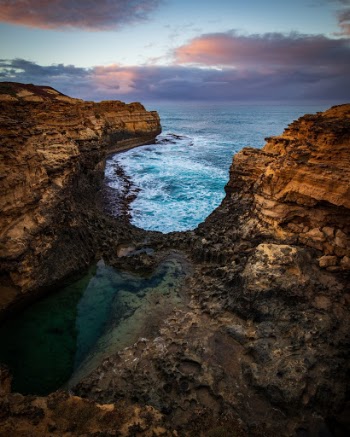 Early dawn against the blue waters of the southern coast of Australia along the Great Ocean Road. 