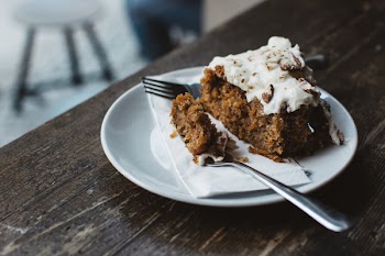 Eating carrot cake in a café 