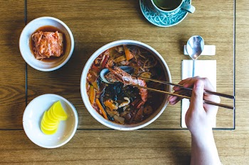Eating Korean seafood stew 