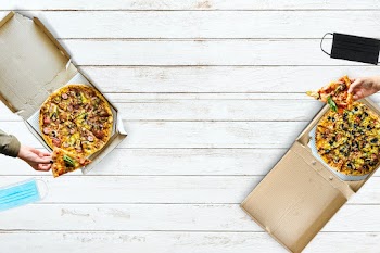 Eating pizza with social distancing in the new normal way