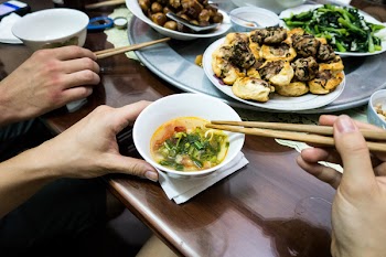 Eating Vietnamese fish soup 