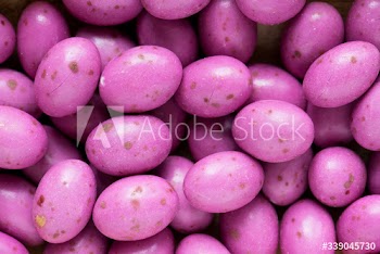 Egg stone bean balls chocolate textured background