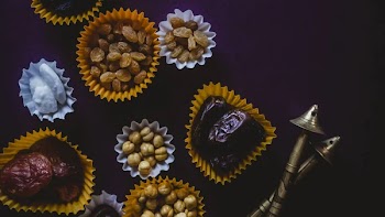 Eid Mubarak. Different iftar sweets. Celebrating Eid Al Adha. Islamic traditional holiday. Eid al-Fitr. Holly month Ramadan. Middle Eastern religious holiday. Dried date fruit. Flat lay, top view.