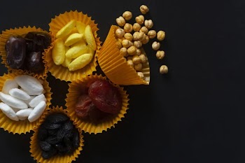 Eid Mubarak. Different iftar sweets. Celebrating Eid Al Adha. Islamic traditional holiday. Eid al-Fitr. Holly month Ramadan. Middle Eastern religious holiday. Dried date fruit. Flat lay, top view.