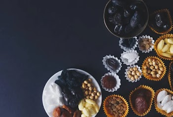 Eid Mubarak. Different iftar sweets. Celebrating Eid Al Adha. Islamic traditional holiday. Eid al-Fitr. Holly month Ramadan. Middle Eastern religious holiday. Dried date fruit. Flat lay, top view.