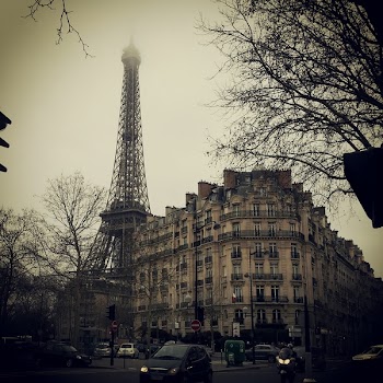 Eiffel Tower behind concrete building