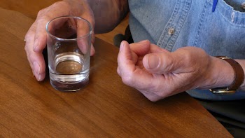 Elderly_Man_taking_medicine.jpg