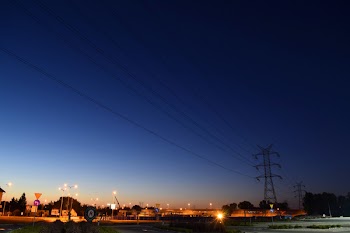 Electric Tower Under Blue Sky during Dawn