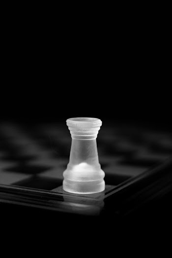 Elegant Transparent Chess Rook on a Dark Board