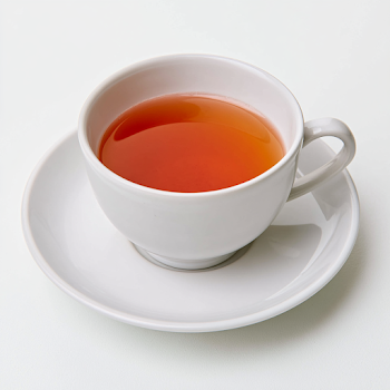 Elegant White Ceramic Tea Cup with Amber Black Tea