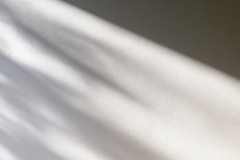 Elegant White Plaster Wall with Subtle Shadows