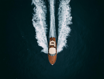 Elegant Wooden Speedboat on Dark Teal Waters