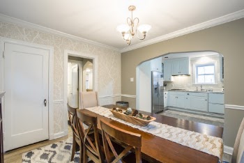 Empty Brown Wooden Dining Table in Middle of Open Room