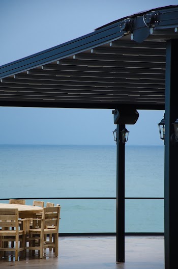 Empty Chairs and Table on the Patio