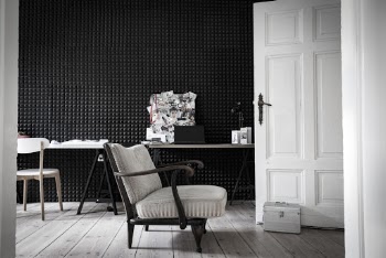 Empty Gray Fabric Armchair in Front of Door